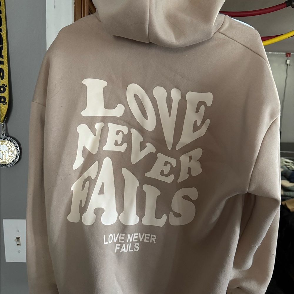 Love Never Fails Tan Hoodie